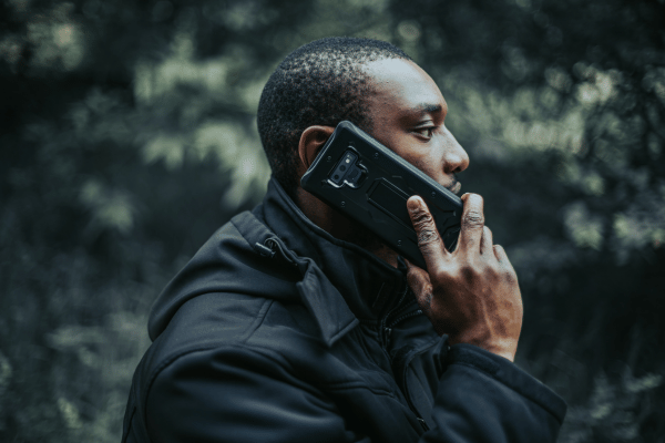 a man on adventure make phone call with phone in his rugged phone case